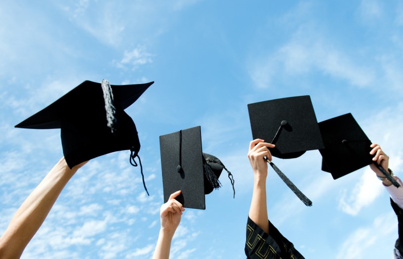 Many hand holding graduation hats on background of blue sky.; Shutterstock ID 128225111; PO: The Huffington Post; Job: The Huffington Post; Client: The Huffington Post; Other: The Huffington Post